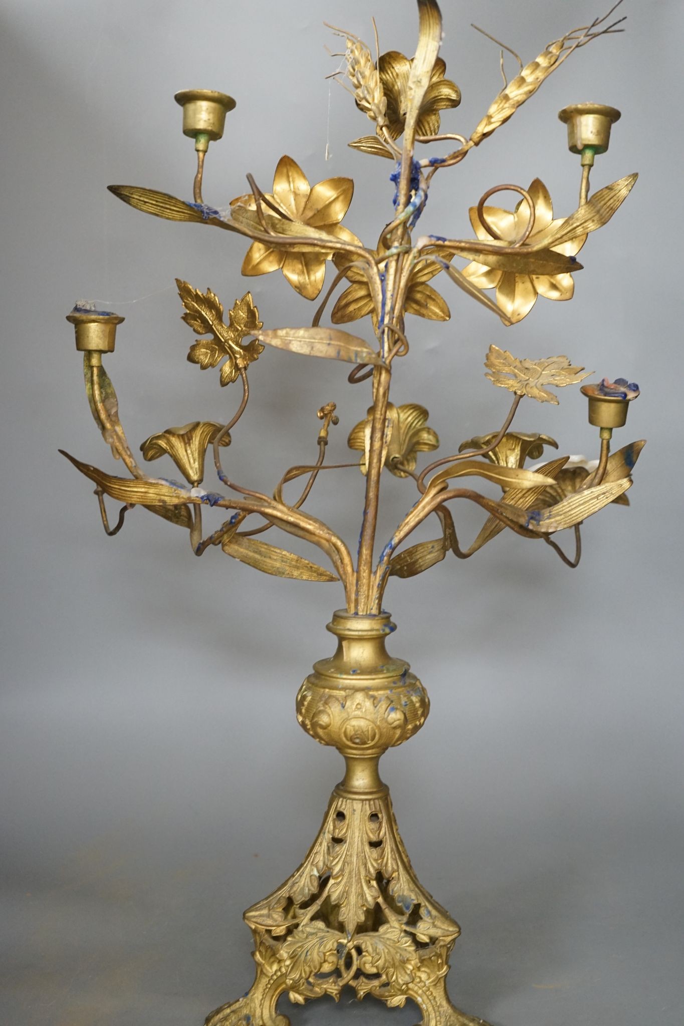 A Victorian cast gilt metal candelabrum, mounted with glass flower heads